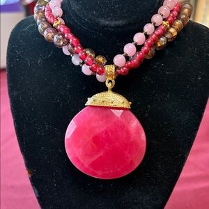 Cherry red pendant on beaded necklace